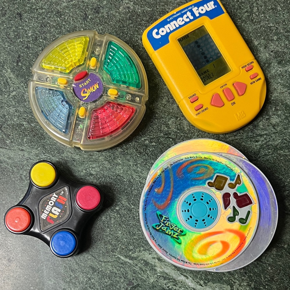 Simons Colorful Memory Game Set all hand held size.